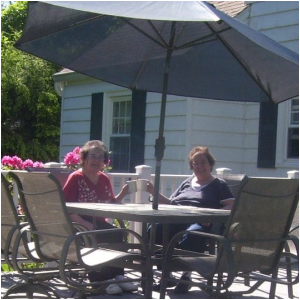 Some women on a back deck