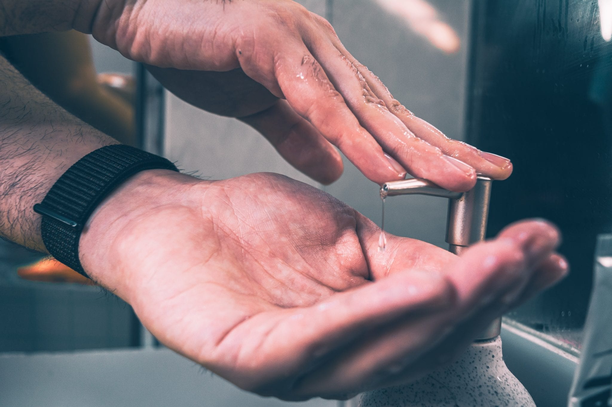 Masculine hands applying soap, photo by Christine Sandu via Unsplash 